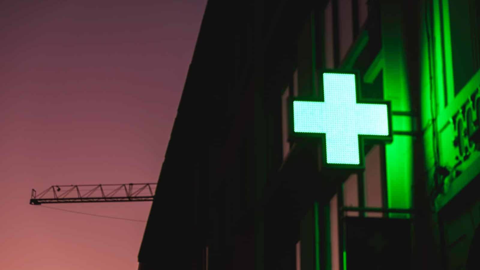 a building with a large white cross on it's side